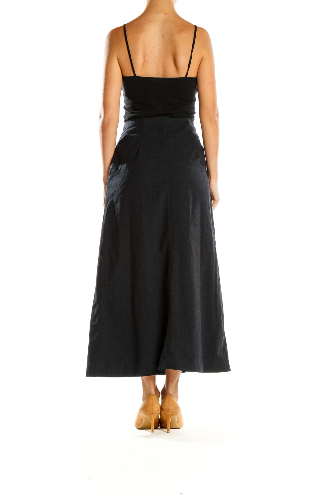 Side view of Banana Republic black A-line midi skirt on model