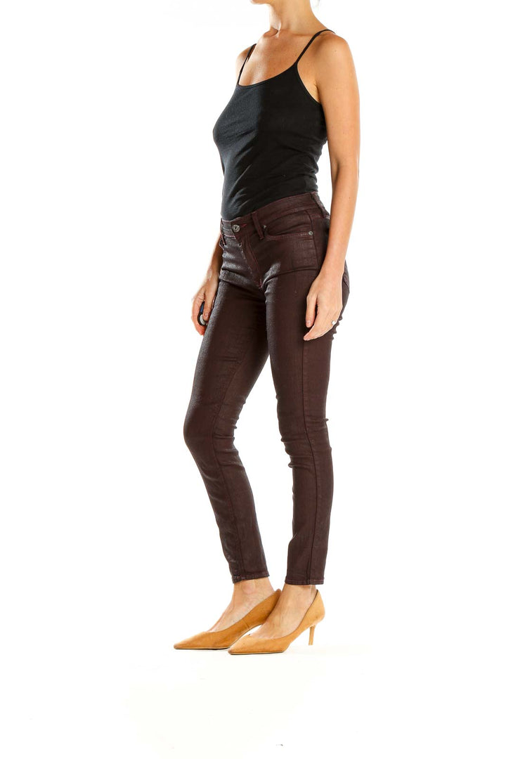 Front view of 7 For All Mankind brown skinny jeans on model