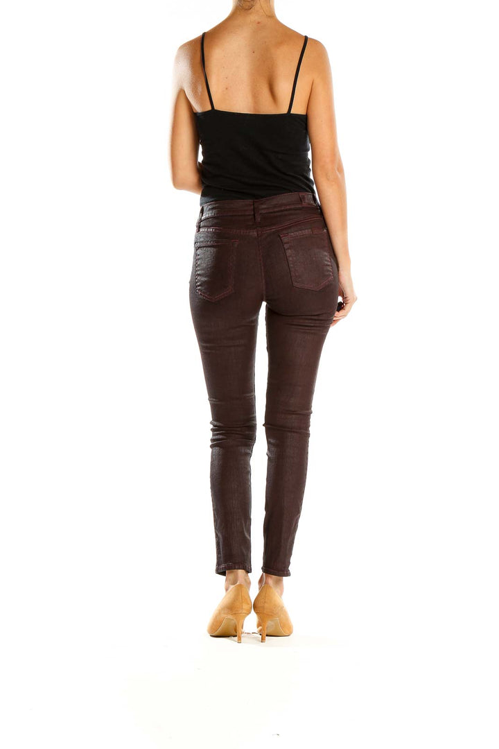Side view of 7 For All Mankind brown skinny jeans on model