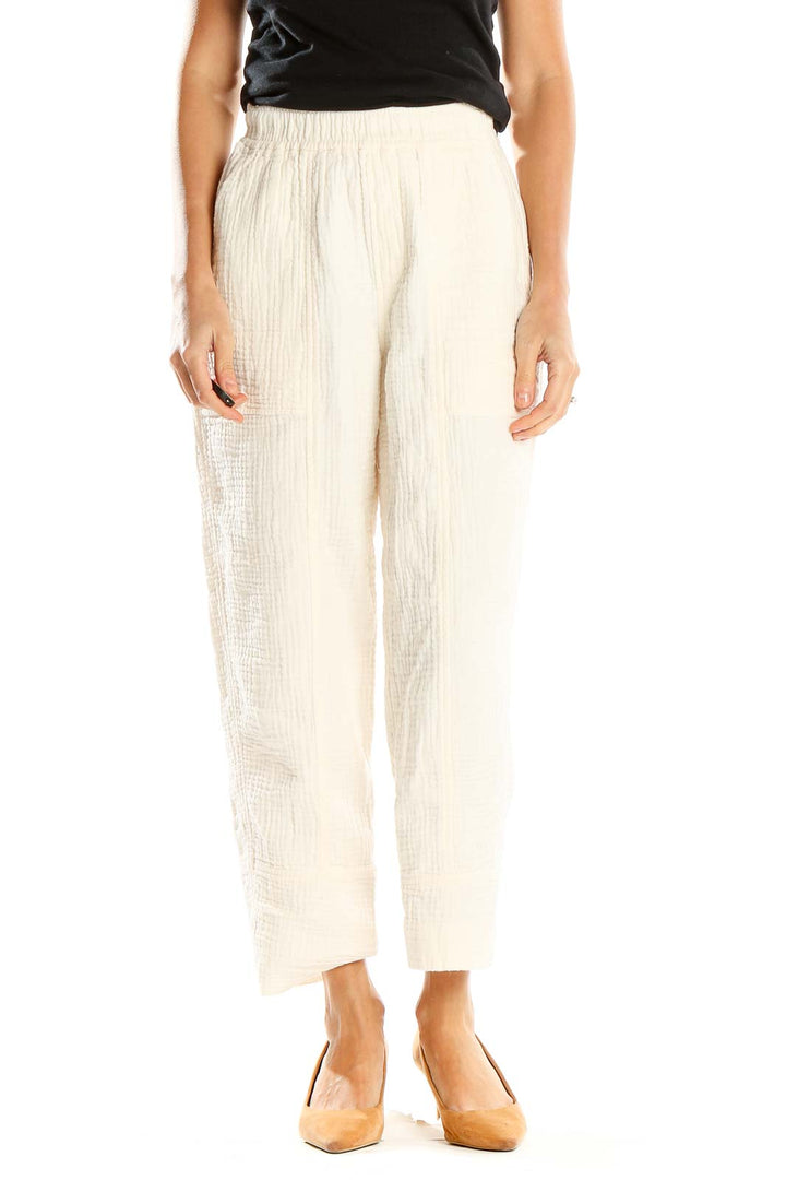 Front view of Madewell cream textured wide-leg pants on model