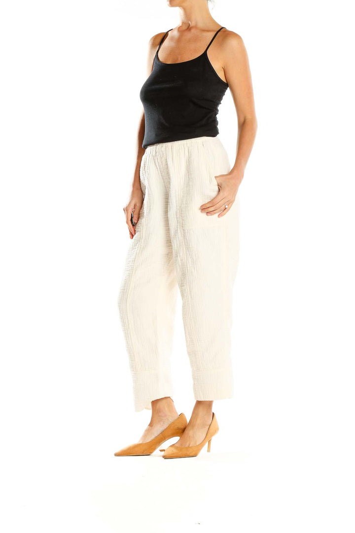 Front view of Madewell cream textured wide-leg pants on model