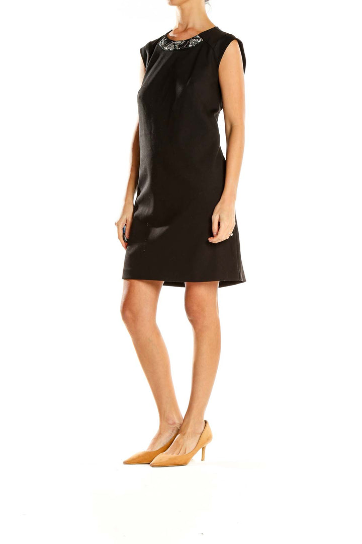 Front view of Ann Taylor black shift dress with embellished neckline