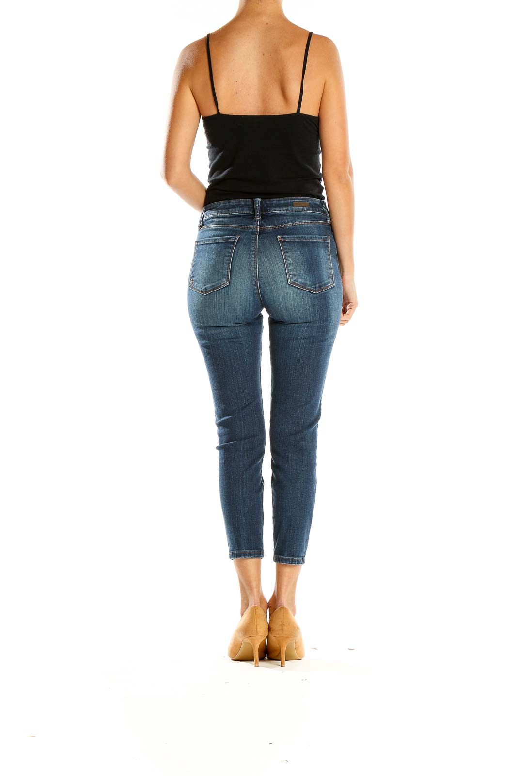 Side view of KUT from the Kloth blue cropped skinny jeans on model