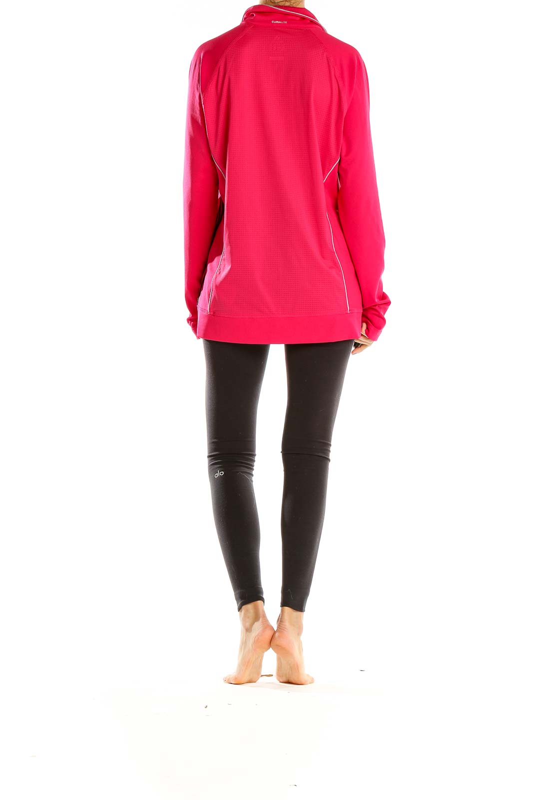 Back view of pink Adidas zip-up athletic jacket on model