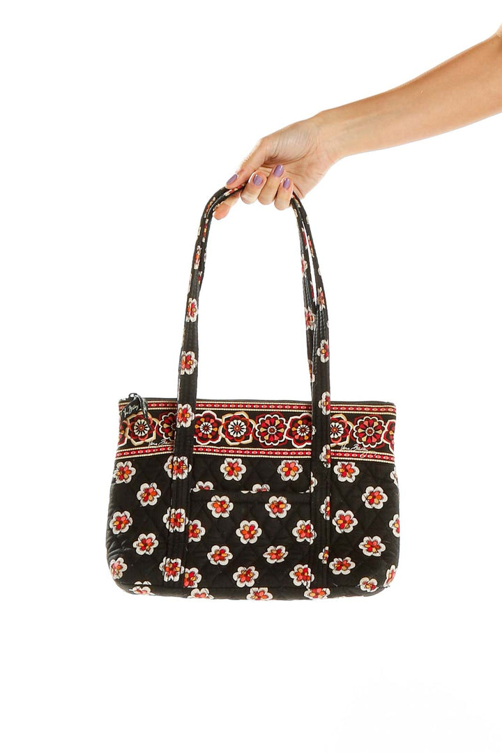 Front view of Vera Bradley black shoulder bag with red and white floral print