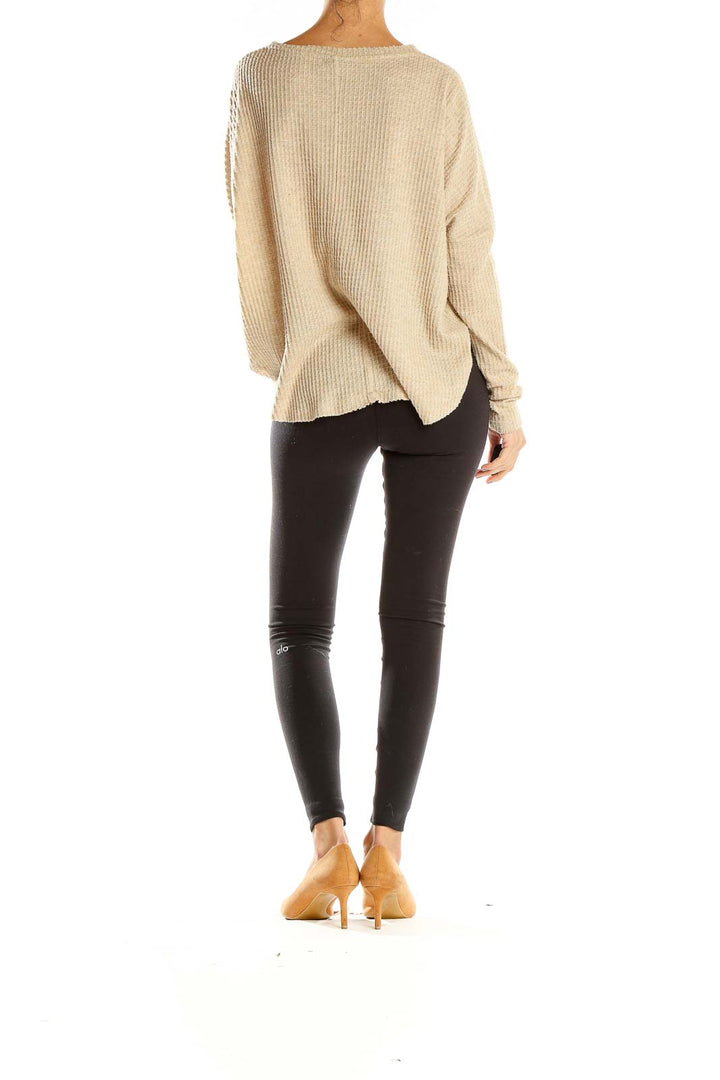 Side view of beige waffle knit button-down top from Out From Under on model