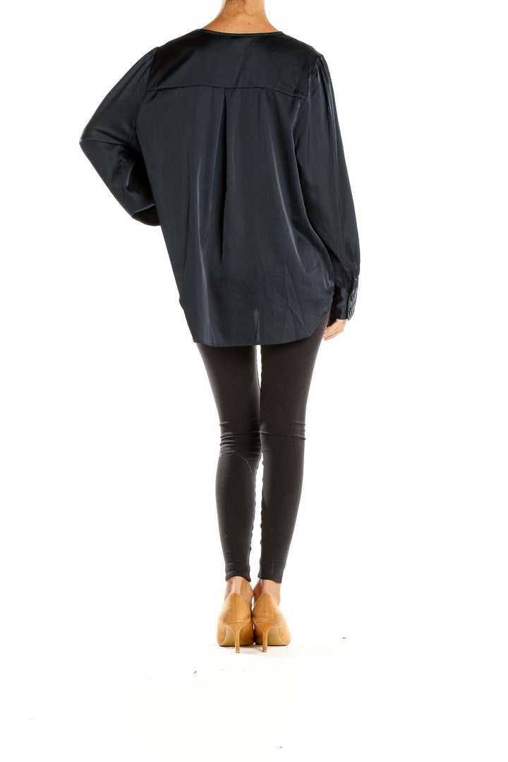 Side view of Banana Republic navy satin wrap blouse showing drape and high-low hemline