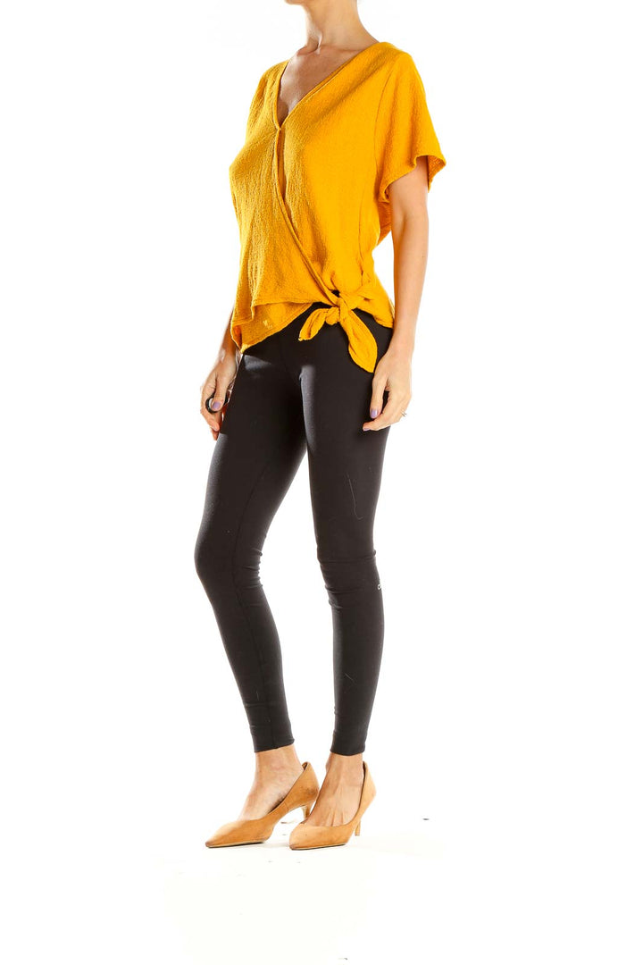 Front view of golden wrap-style short sleeve top from Texture & Thread Madewell