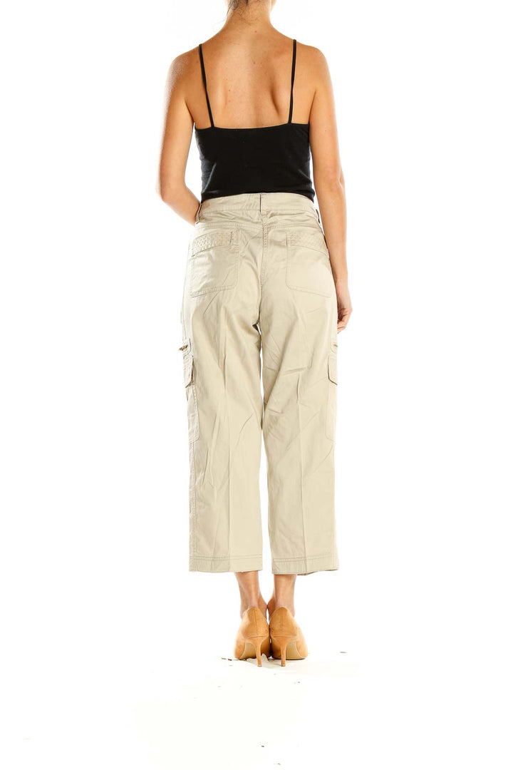 Side view of Cache beige cropped cargo pants on model