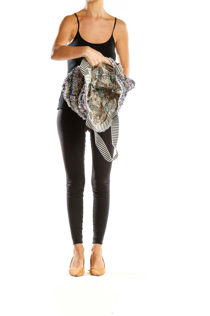 Side view of model carrying Maaji multicolor textured tote bag