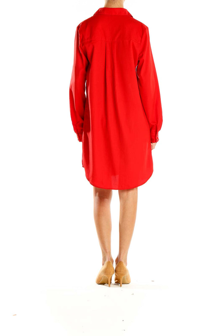 Side view of red Mustard Seed button-down shirt dress with high-low hemline