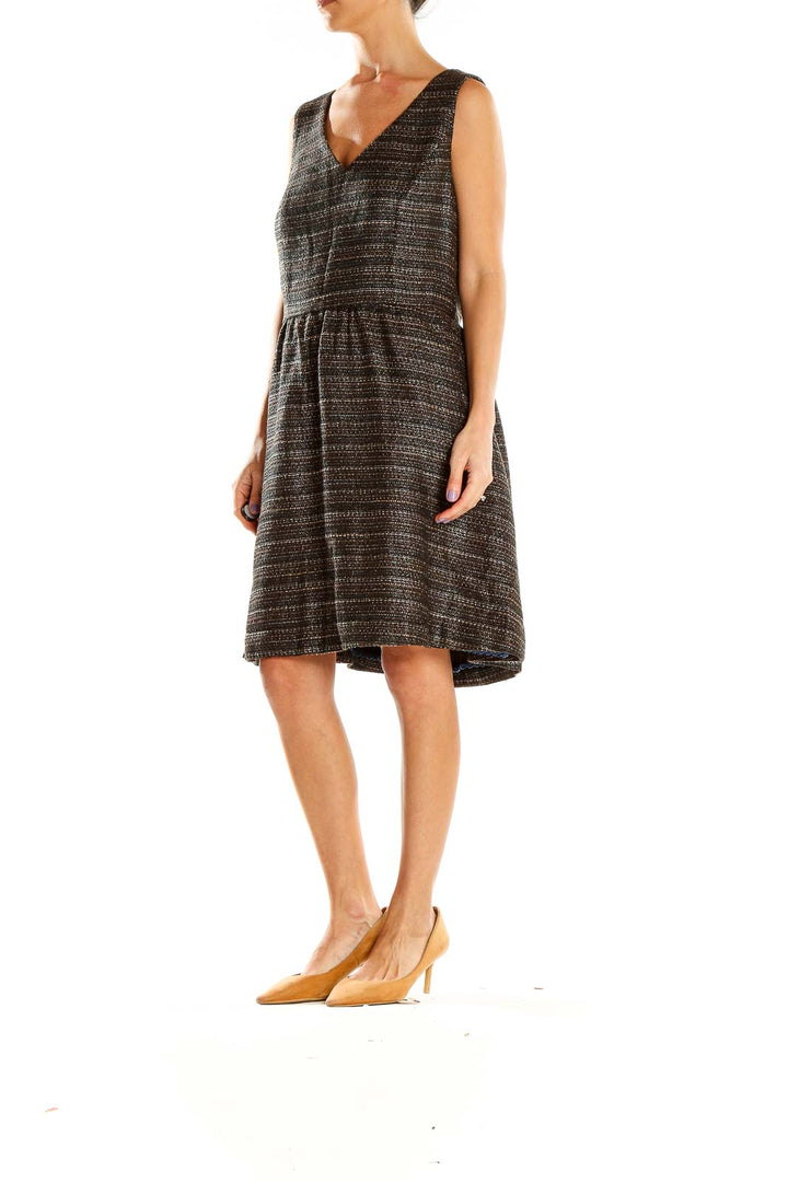 Front view of Moulinette Soeurs black textured V-neck midi dress