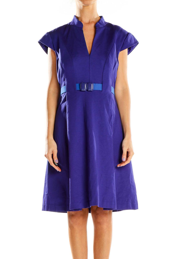 Front view of purple Trina Turk A-line dress with cap sleeves and blue bow accent