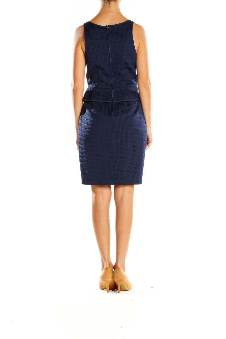 Side view of Club Monaco navy textured peplum sheath dress