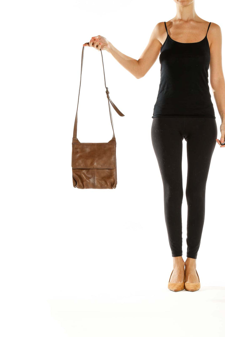 Front view of brown leather crossbody bag by RPS Bags