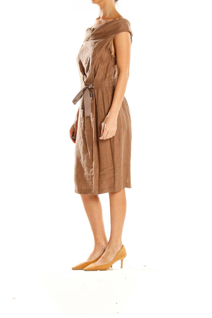 Front view of tan off-shoulder linen midi dress by NIU with side tie