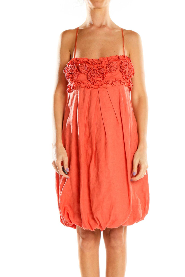 Front view of coral Rinascimento dress with floral embellished bodice and bubble skirt