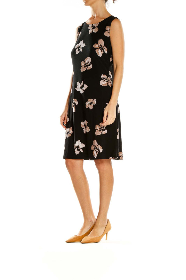 Front view of Tommy Hilfiger black sleeveless dress with pink and white floral print
