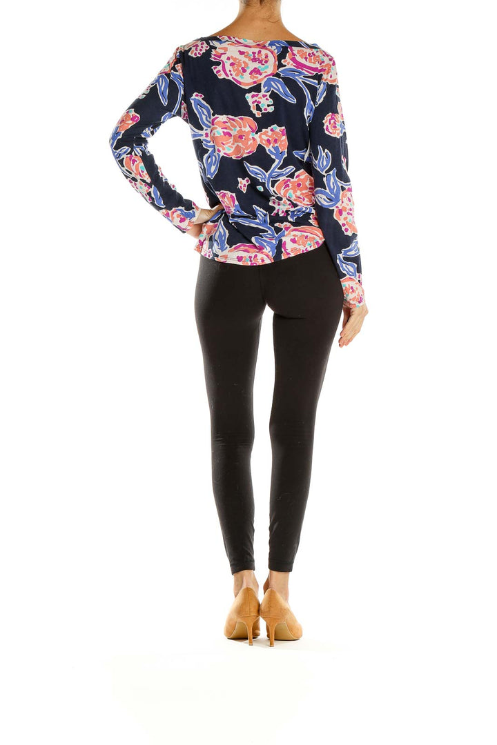 Back view of Lilly Pulitzer navy floral long sleeve boat neck top on model