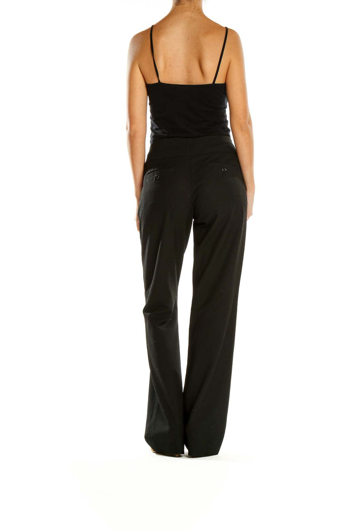 Side view of woman wearing The Limited black wide-leg dress pants