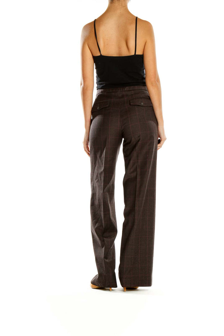 Side view of Banana Republic brown plaid wide-leg trousers on model with black top