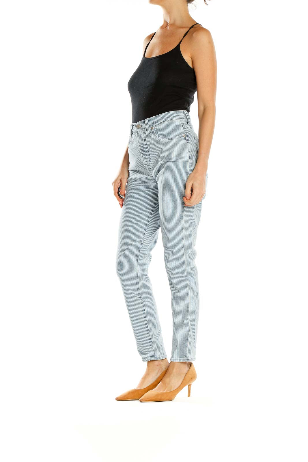 Front view of Madewell light blue striped high-waisted jeans on model