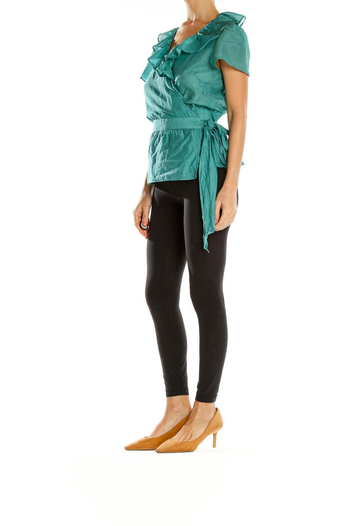 Front view of teal ruffled wrap blouse from Ann Taylor LOFT