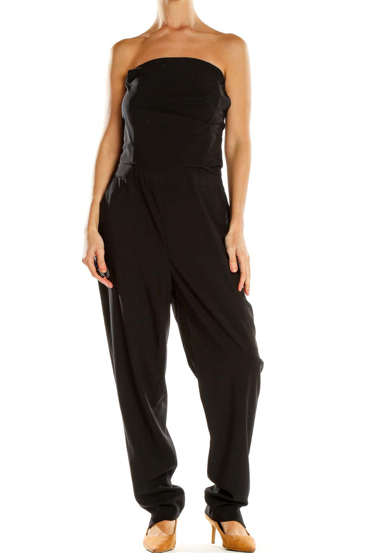 Front view of black strapless jumpsuit by Silence + Noise