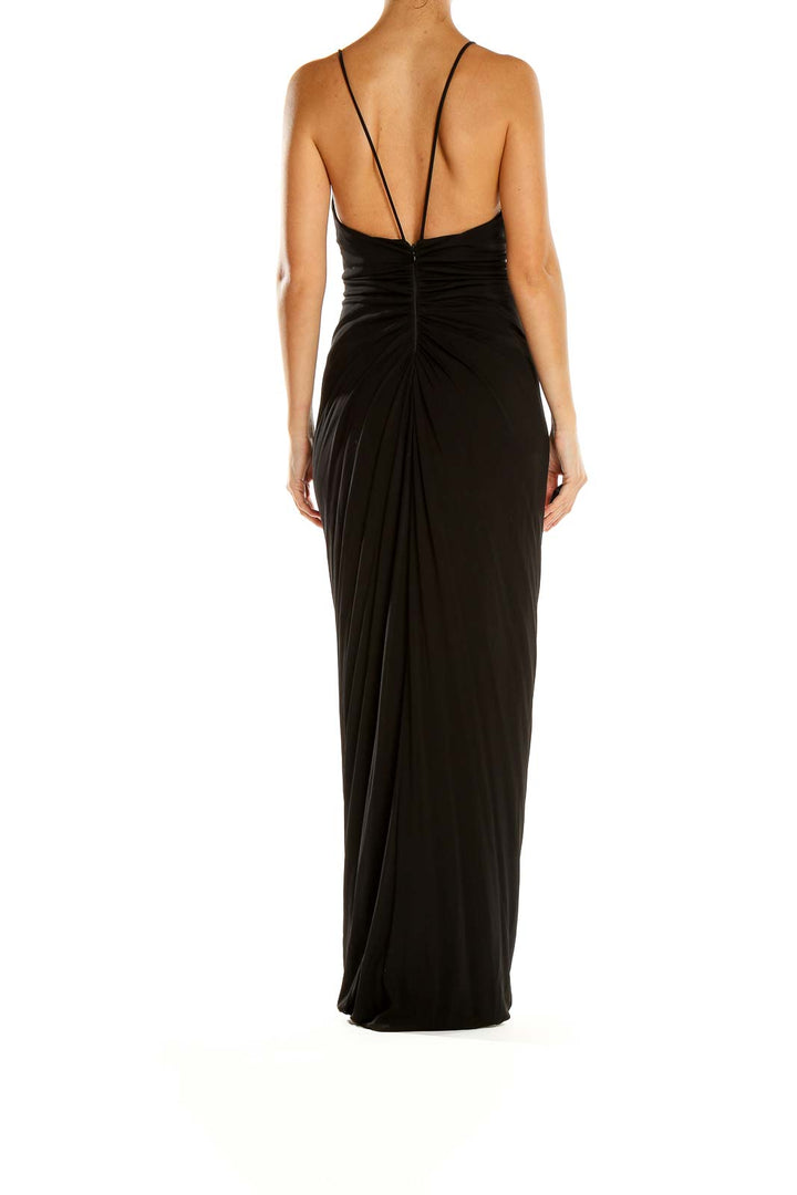 Side view of Cut25 black floor-length maxi dress showing low back