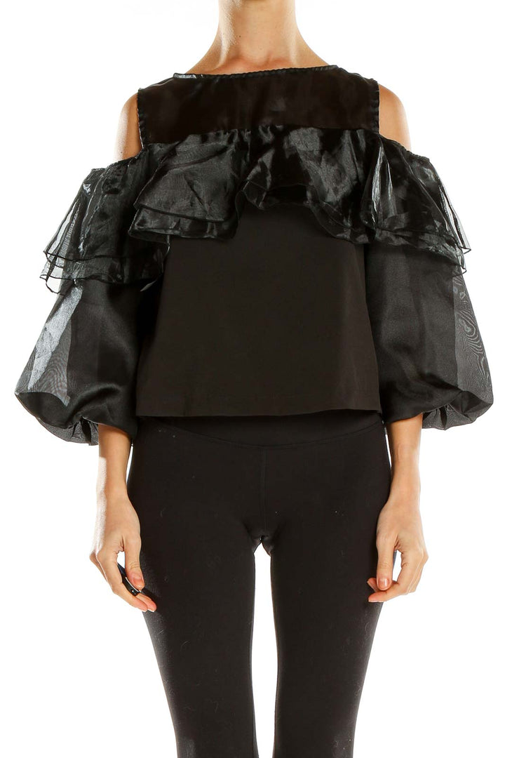 Front view of black ruffled cold-shoulder top by Twist x Turn