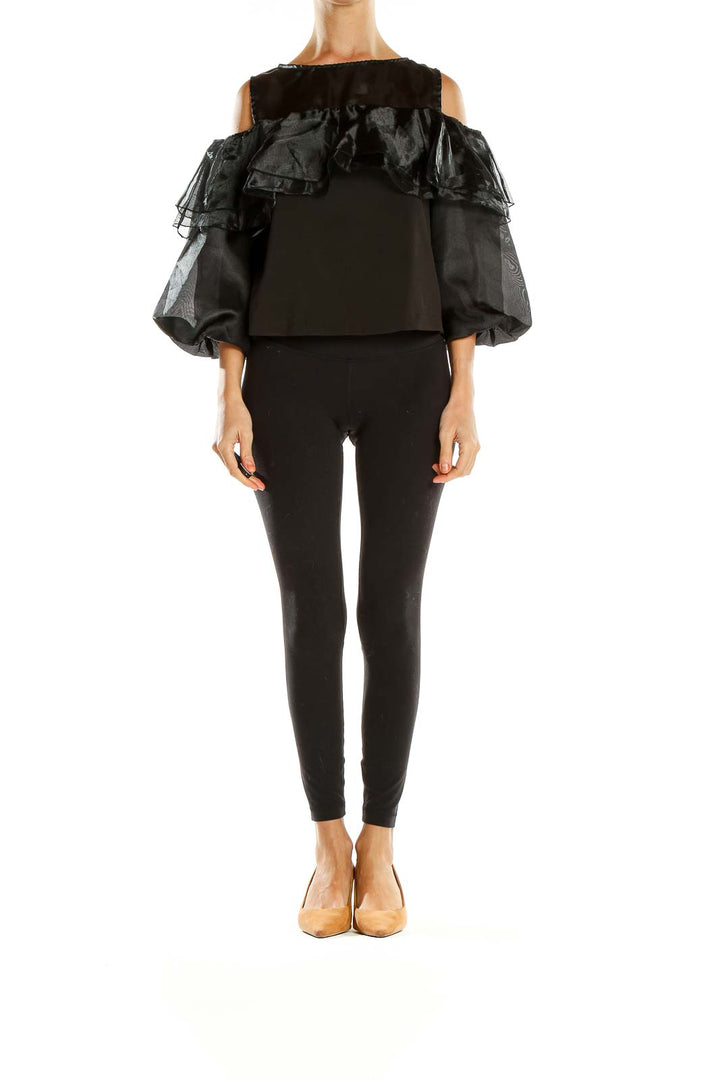 Front view of black ruffled cold-shoulder top by Twist x Turn