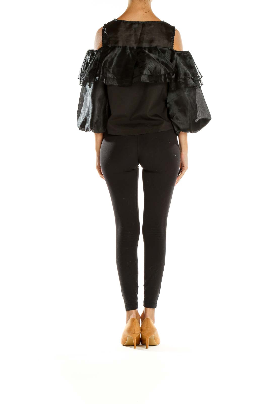 Side view of black ruffled cold-shoulder top by Twist x Turn with model