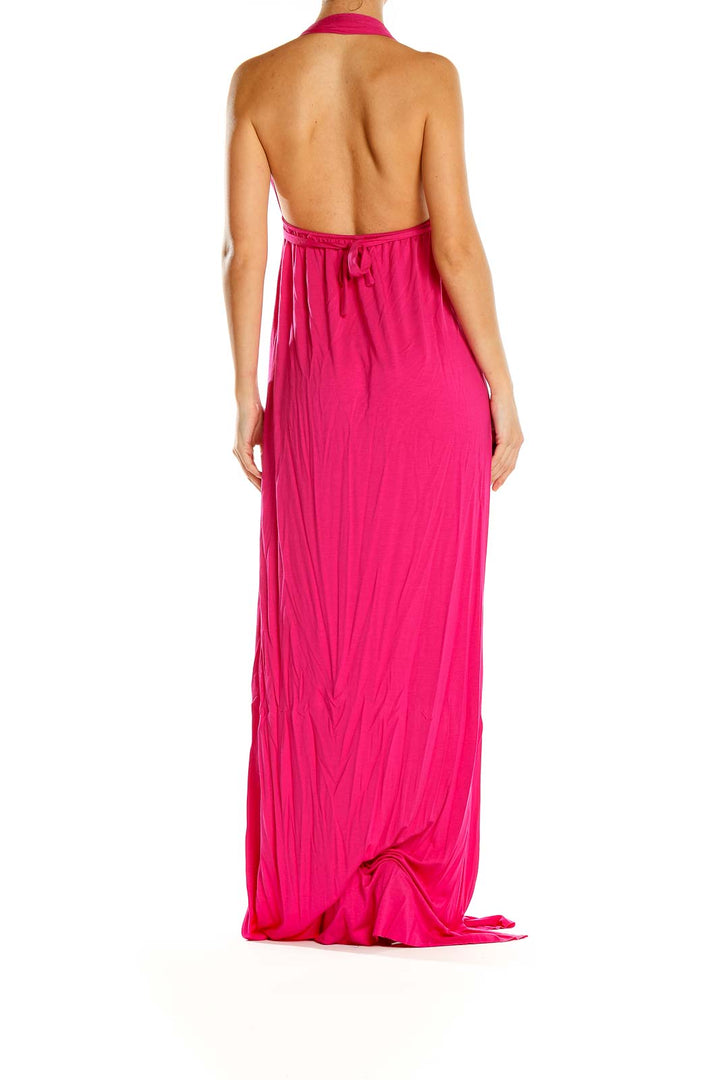 Side view of Rachel Pally hot pink halter maxi dress on model