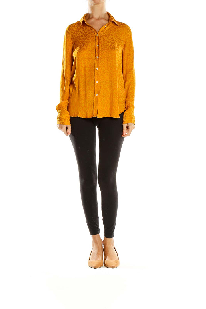 Front view of Banana Republic golden leopard print button-down shirt