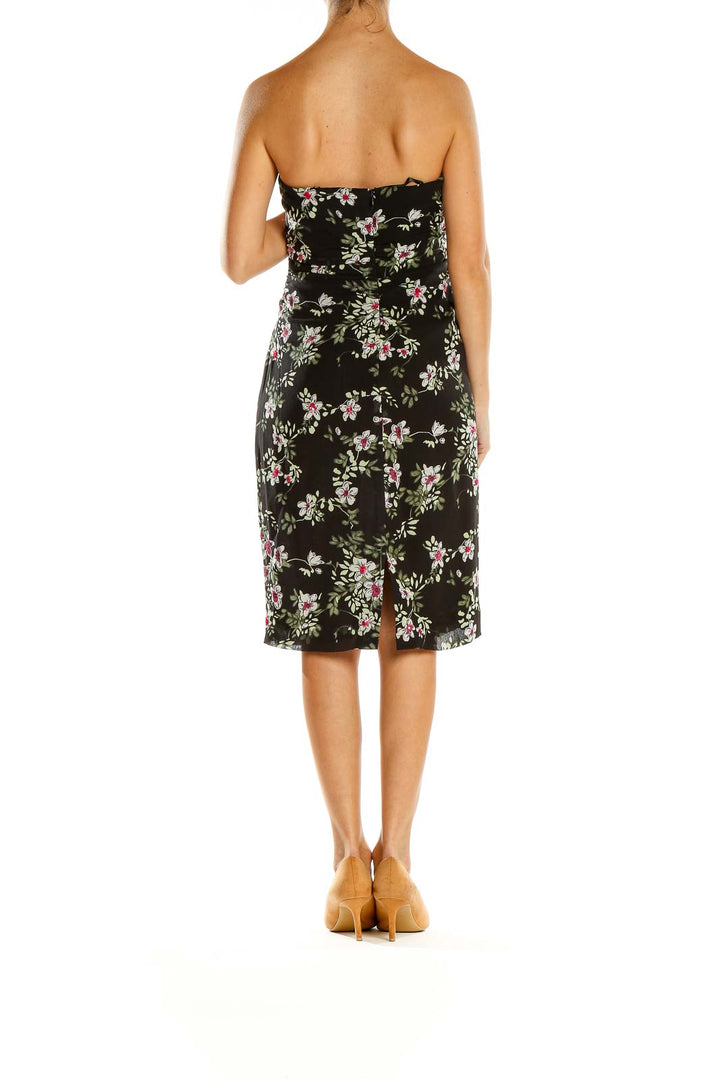 Back view of Nicole Miller black floral strapless cocktail dress