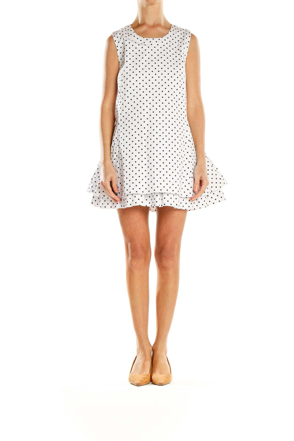 Front view of white polka dot sleeveless mini dress with ruffle hem