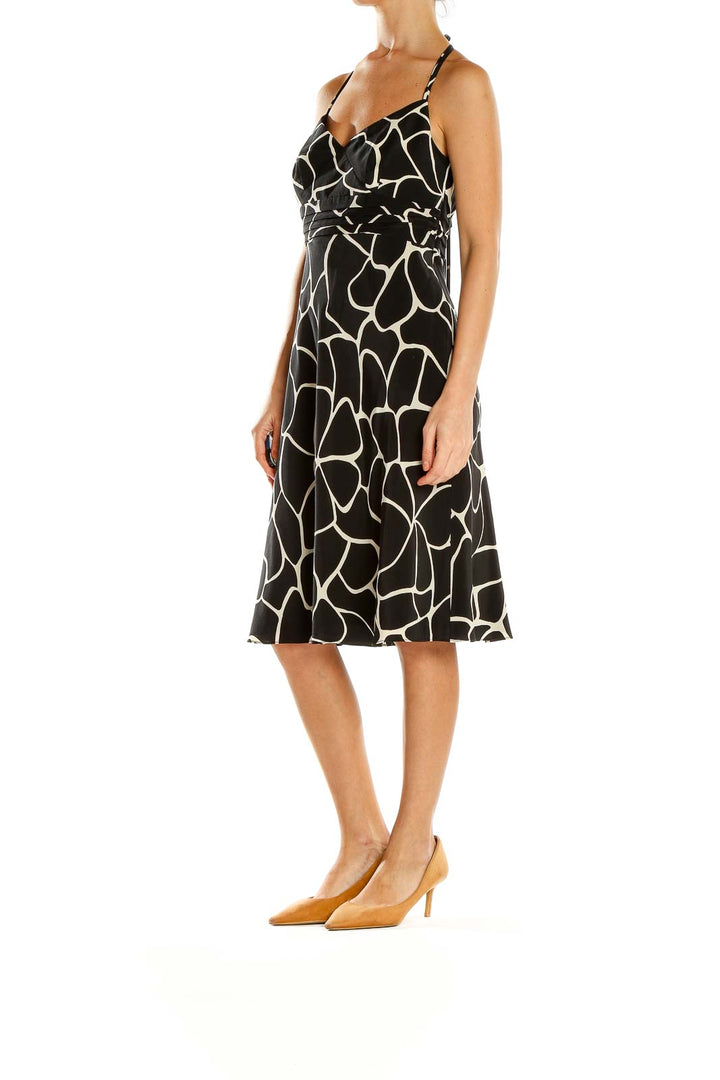Front view of Ann Taylor black and white giraffe print halter dress