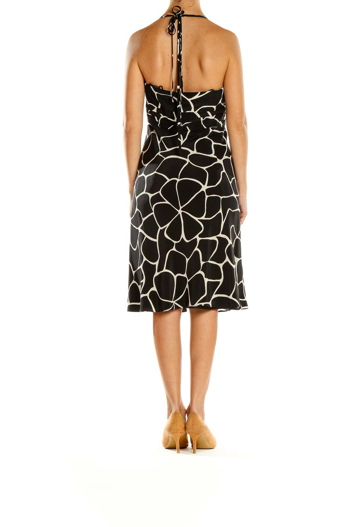 Side view of Ann Taylor black and white giraffe print halter dress