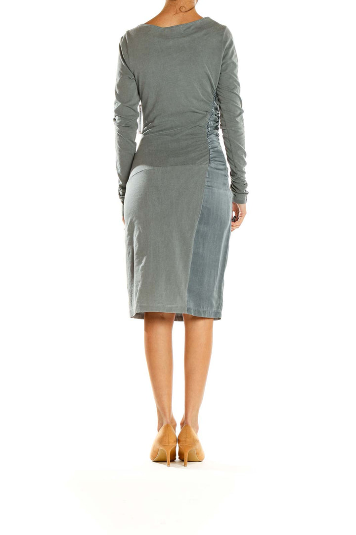 Side view of gray bodycon midi dress showing ruched details and fit