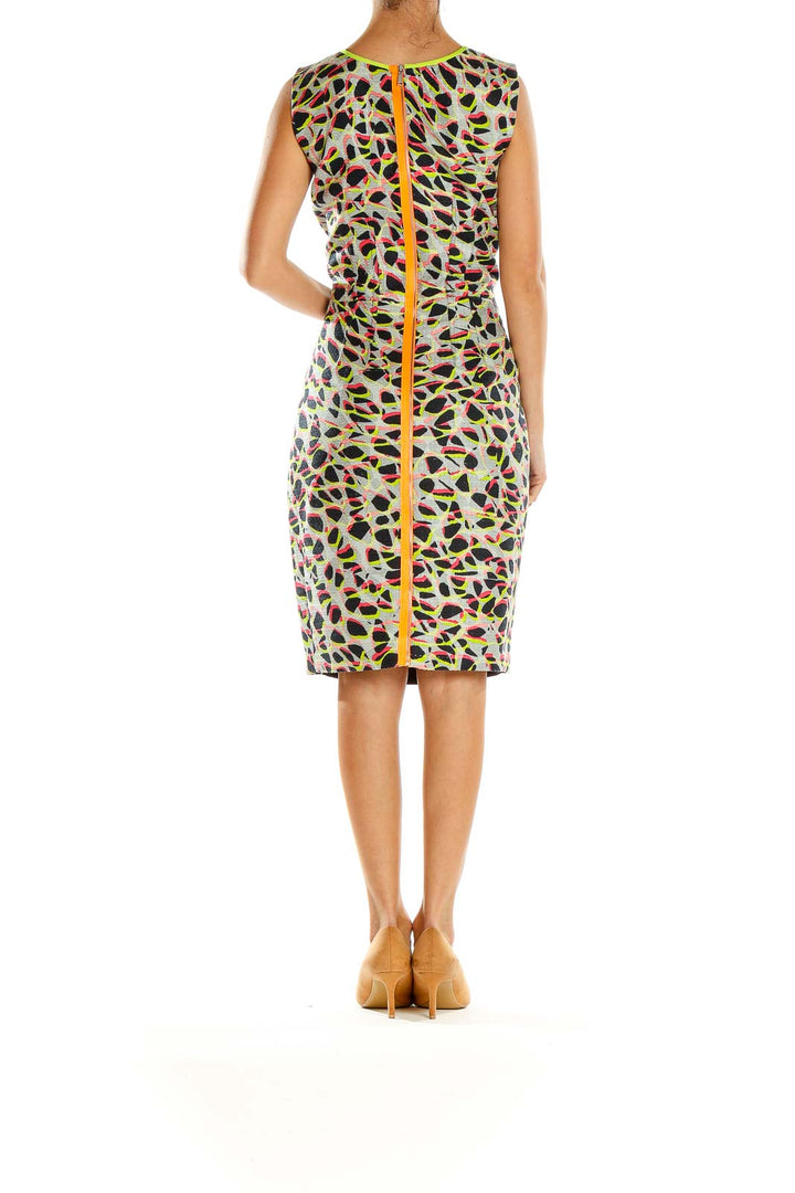 Side view of Elie Tahari black sheath dress showing colorful abstract pattern detail