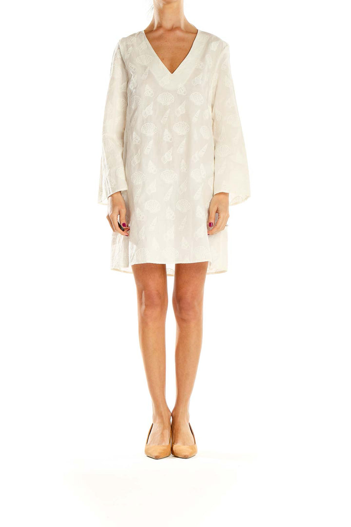 Front view of white embroidered V-neck shift dress from & Other Stories