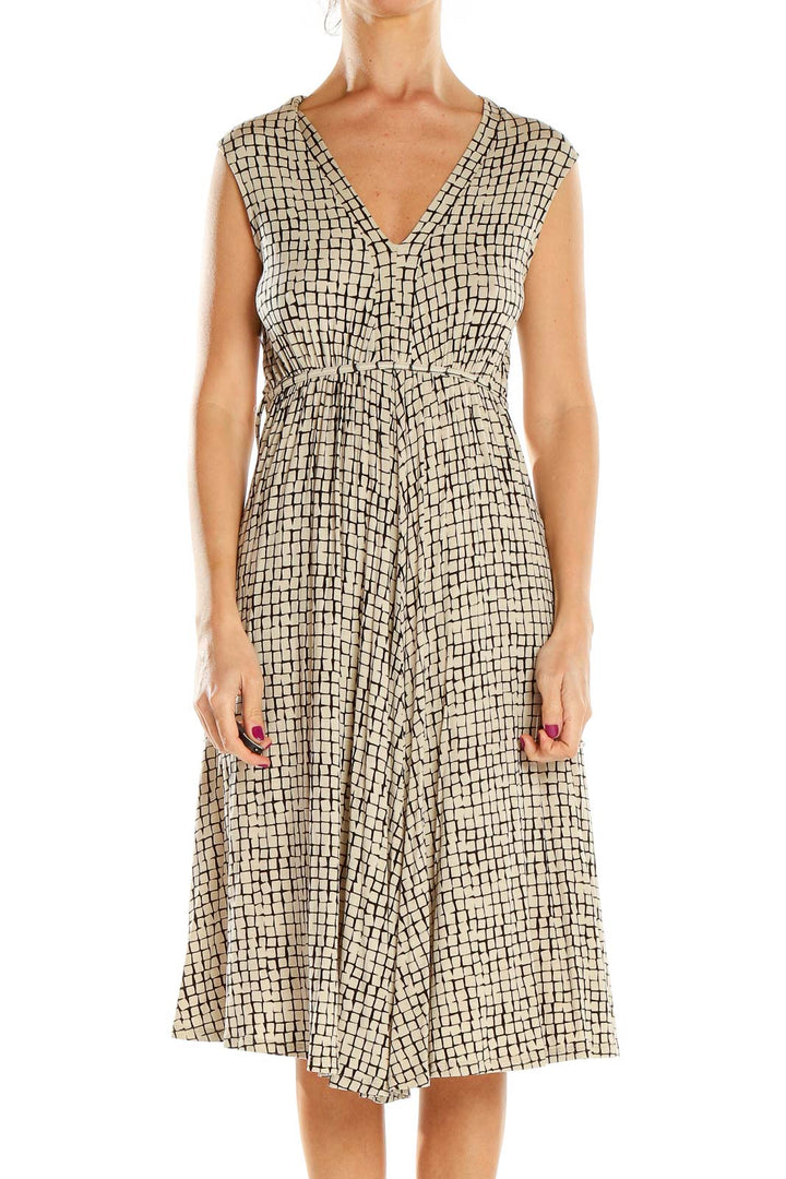 Front view of Jigsaw London beige geometric print V-neck midi dress