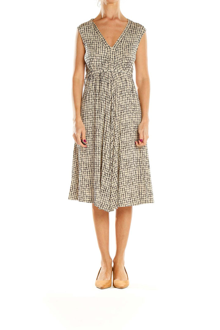 Front view of Jigsaw London beige geometric print V-neck midi dress