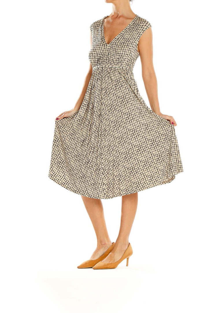 Front view of Jigsaw London beige geometric print V-neck midi dress