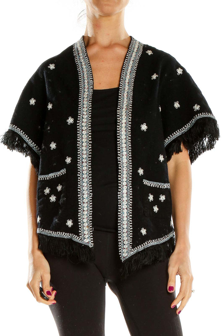 Front view of SilkRoll black embellished jacket with silver floral embroidery and fringe details
