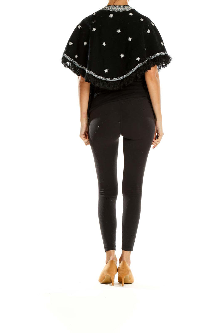Side view of SilkRoll black embellished jacket showing open-front design and fringe trim