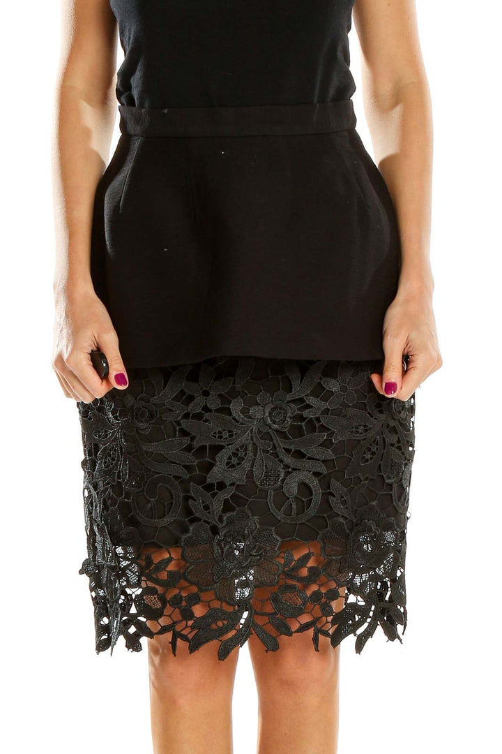 Front view of Cameo The Label black peplum skirt with lace overlay