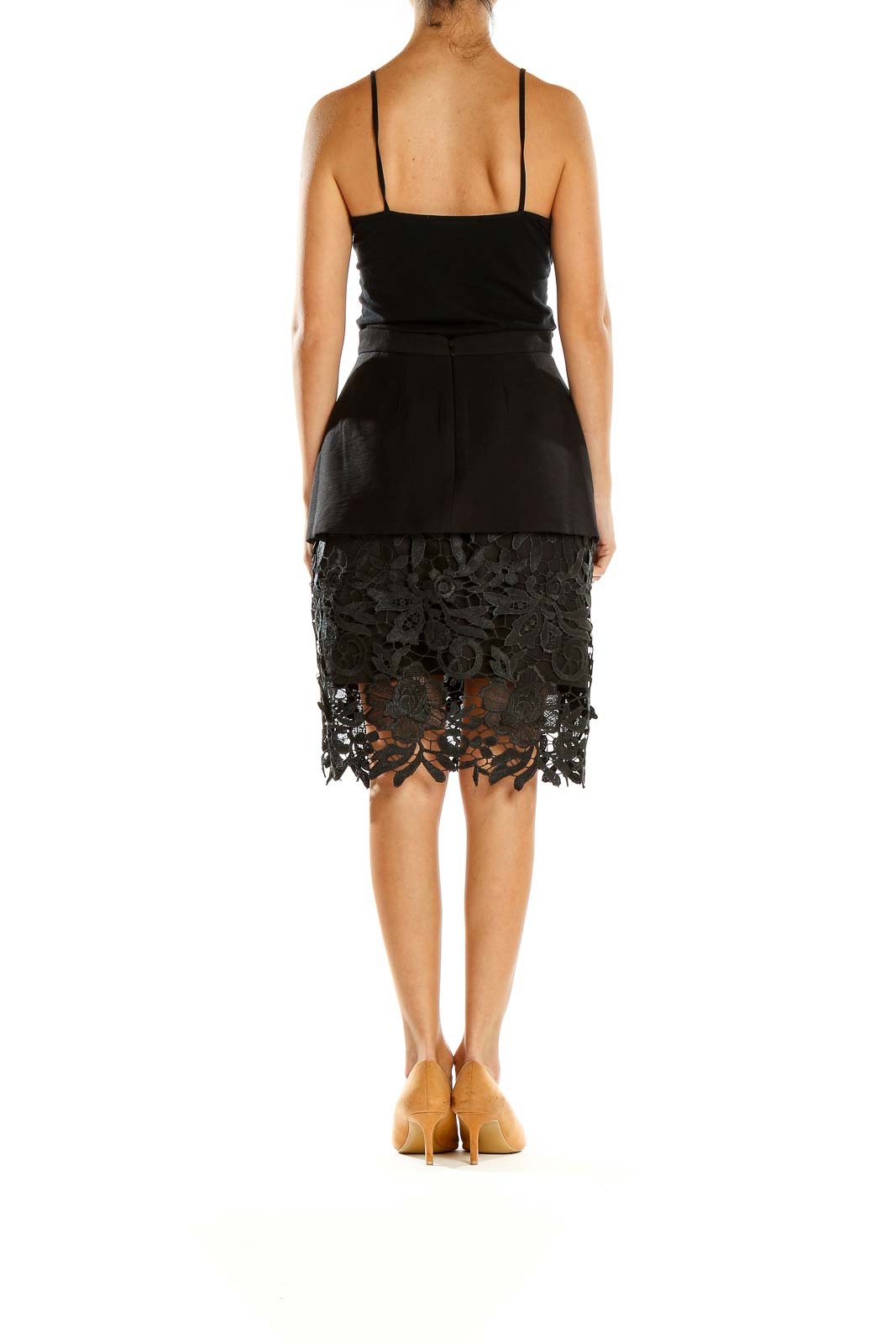 Side view of Cameo The Label black peplum skirt showing lace detail
