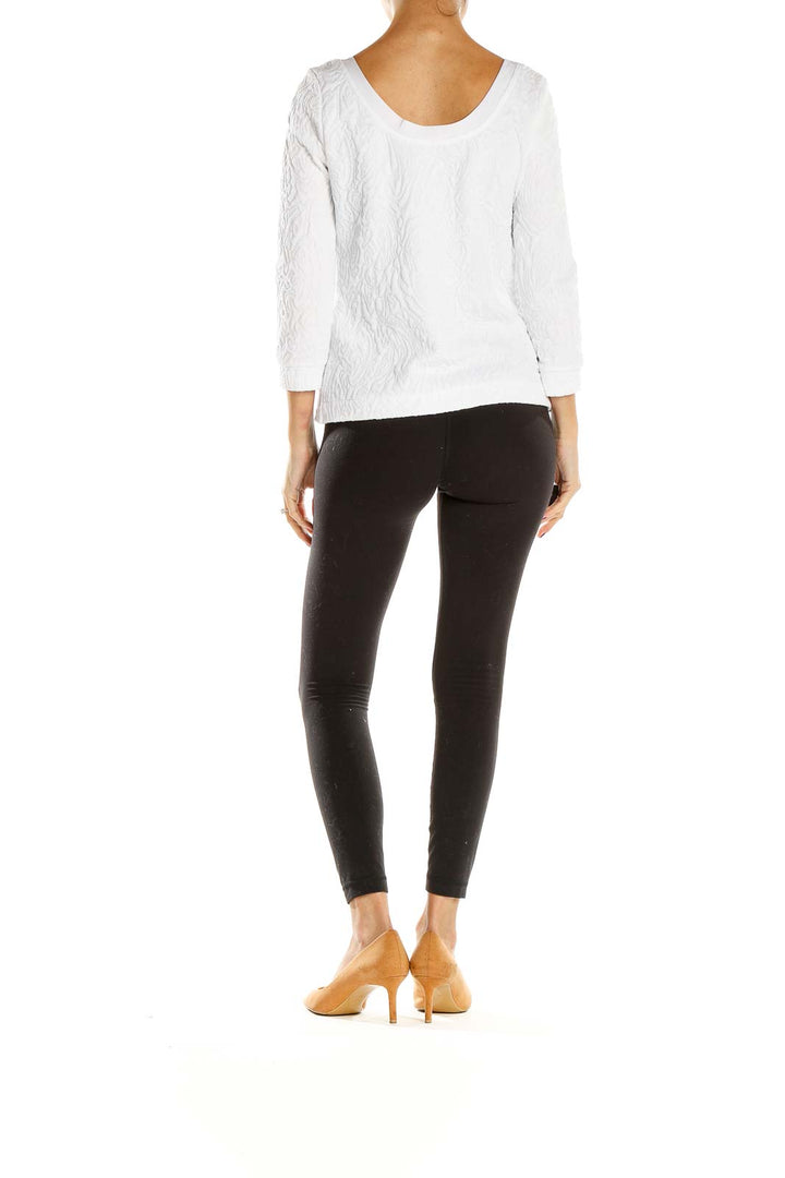 Back view of Banana Republic white textured long sleeve blouse on model