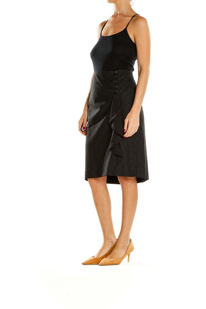 Front view of Classiques Entier black plaid wrap pencil skirt with ruffle detail